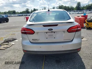 2015 Ford Focus Titanium with VIN 1FADP3J27FL267339, listed as a Copart auction lot 63395835 with 73,372 mi miles and Salvage title. Bid and sale history available at DreamBid. Image 6.