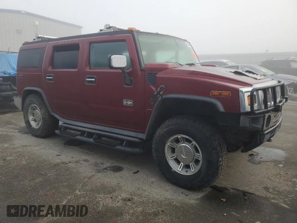 2003 Hummer H2 with VIN 5GRGN23UX3H147490, listed as a Copart auction lot 82876424 with 241,737 mi miles and Clean Title. Bid and sale history available at carsss.com. Image 4.