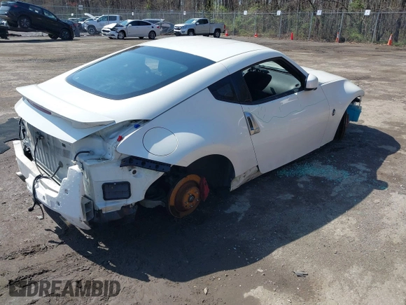 2014 Nissan 370Z with VIN JN1AZ4EH8EM634403, listed as a IAAI auction lot 41923568 with 137,676 mi miles. Bid and sale history available at carsss.com. Image 4.