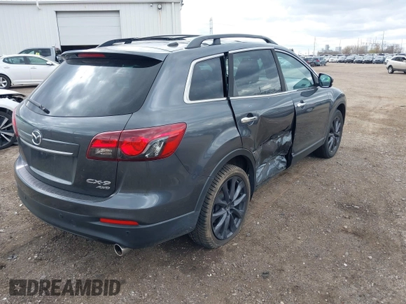 2015 Mazda CX-9 Grand Touring with VIN JM3TB3DV1F0465966, listed as a IAAI auction lot 42049749 with 74,470 mi miles and . Bid and sale history available at DreamBid. Image 4.