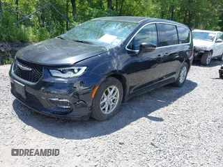2023 Chrysler Pacifica Touring L with VIN 2C4RC1BG2PR534194, listed as a IAAI auction lot 42613934 with 69,896 mi miles and . Bid and sale history available at DreamBid. Image 18.