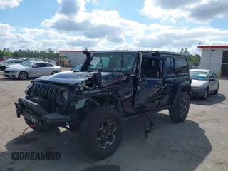2023 Jeep Wrangler Rubicon with VIN 1C4HJXFGXPW534515, listed as a IAAI auction lot 41524419 with 21,376 mi miles and . Bid and sale history available at DreamBid. Image 6.
