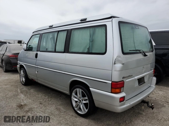 2003 Volkswagen EuroVan MV с VIN WV2NB47083H002700, выставлен на аукционе Copart как лот 76117874 с пробегом 186 942 миль миль и На запчасти • Non repairable. История ставок и продаж доступна на DreamBid. Изображение 2.