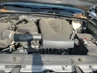 2021 Toyota Tacoma SR z VIN 5TFCZ5AN7MX255218, wystawiony jako Copart lot #87247455 z przebiegiem 76 862 mil mil oraz Szkoda całkowita • Salvage title. Historia ofert i sprzedaży dostępna na DreamBid. Obrazek 13.