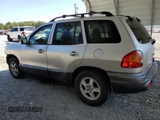 2001 Hyundai Santa Fe GLS with VIN KM8SC83D31U010136, listed as a Copart auction lot 69809604 with 79,823 mi miles and Salvage Title. Bid and sale history available at carsss.com. Image 2.