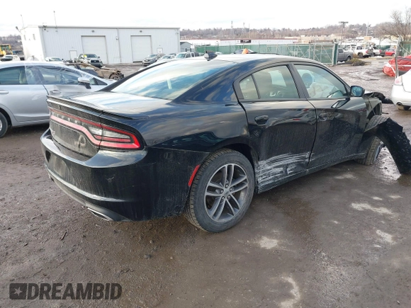 2019 Dodge Charger SXT with VIN 2C3CDXJG3KH630975, listed as a IAAI auction lot 41580174 with 74,575 mi miles and . Bid and sale history available at DreamBid. Image 4.