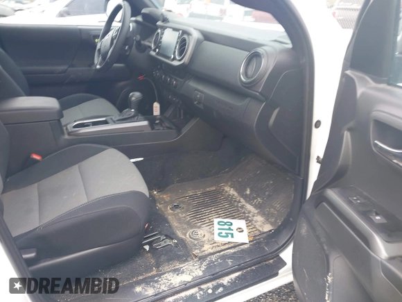 2023 Toyota Tacoma SR with VIN 3TMCZ5AN2PM641846, listed as a IAAI auction lot 41948660 with 21,969 mi miles and . Bid and sale history available at DreamBid. Image 5.