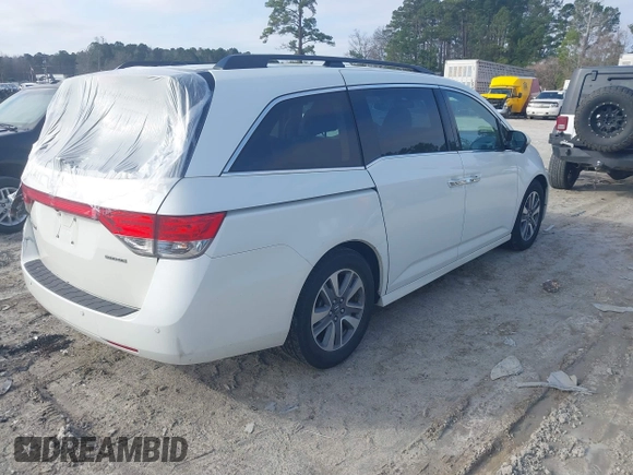 2014 Honda Odyssey Touring with VIN 5FNRL5H97EB127836, listed as a IAAI auction lot 41497413 with 174,914 mi miles and . Bid and sale history available at DreamBid. Image 4.