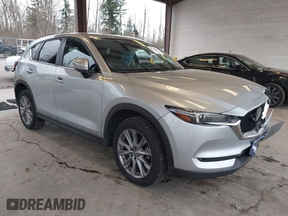 2020 Mazda CX-5 Grand Touring with VIN JM3KFADM0L0738693, listed as a IAAI auction lot 41725906 with 63,629 mi miles. Bid and sale history available at carsss.com. Image 1.