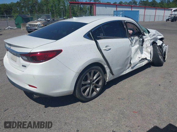 2016 Mazda Mazda6 i Grand Touring with VIN JM1GJ1W55G1443186, listed as a IAAI auction lot 42063716 with 114,263 mi miles. Bid and sale history available at carsss.com. Image 4.