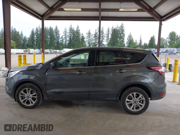 2017 Ford Escape SE z VIN 1FMCU9G93HUC97081, wystawiony jako IAAI lot #42327866 z przebiegiem 97 580 mil mil oraz . Historia ofert i sprzedaży dostępna na DreamBid. Obrazek 14.