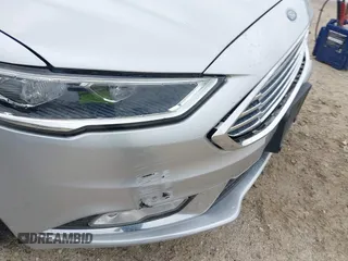 2017 Ford Fusion SE z VIN 3FA6P0HD5HR166433, wystawiony jako IAAI lot #42394998 z przebiegiem 121 333 mil mil oraz . Historia ofert i sprzedaży dostępna na DreamBid. Obrazek 18.