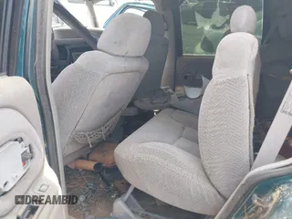 1996 GMC Yukon with VIN 1GKEC13R7TJ704518, listed as a IAAI auction lot 42095936 with 1 mi miles. Bid and sale history available at carsss.com. Image 8.