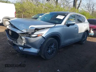 2020 Mazda CX-5 Touring with VIN JM3KFACM5L0766698, listed as a IAAI auction lot 42006157 with 80,288 mi miles and . Bid and sale history available at carsss.com. Image 2.