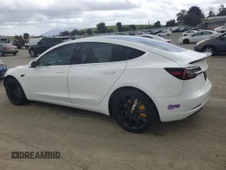 2019 Tesla Model 3 Mid Range with VIN 5YJ3E1EA8KF412886, listed as a Copart auction lot 50824565 with 54,803 mi miles and Salvage Title. Bid and sale history available at carsss.com. Image 2.
