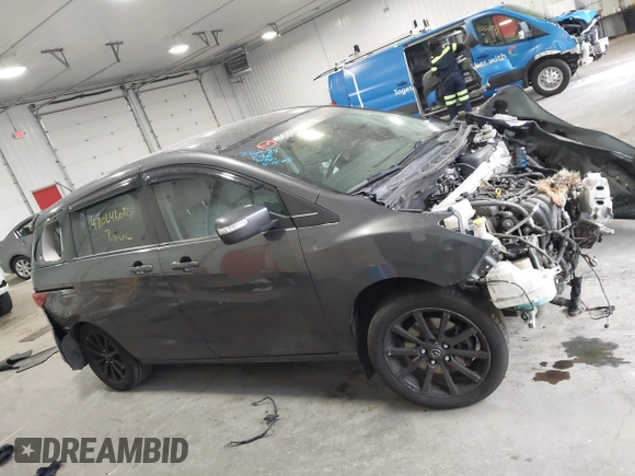 2014 Mazda 5 Sport z VIN JM1CW2BLXE0164748, wystawiony jako IAAI lot #42064606 z przebiegiem 140 169 mil mil oraz . Historia ofert i sprzedaży dostępna na DreamBid. Obrazek 13.