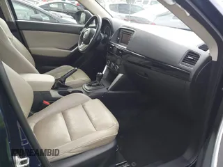 2014 Mazda CX-5 Grand Touring with VIN JM3KE2DY1E0307911, listed as a IAAI auction lot 42064898 with 133,934 mi miles. Bid and sale history available at carsss.com. Image 5.