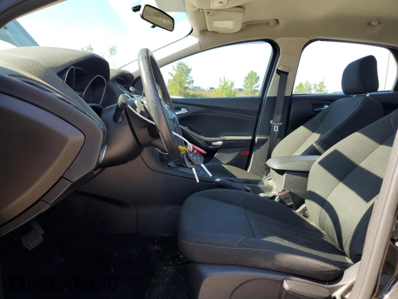 2016 Ford Focus SE z VIN 1FADP3F2XGL261707, wystawiony jako Copart lot #59078565 z przebiegiem 79 820 mil mil oraz Szkoda całkowita • Salvage title. Historia ofert i sprzedaży dostępna na DreamBid. Obrazek 7.