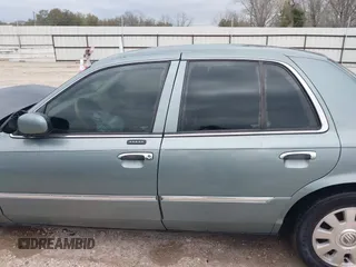 2005 Mercury Grand Marquis LS Premium z VIN 2MEHM75W45X662040, wystawiony jako IAAI lot #41697234 z przebiegiem 214 410 mil mil oraz . Historia ofert i sprzedaży dostępna na DreamBid. Obrazek 15.