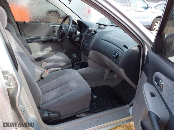 2003 Mazda Protege DX with VIN JM1BJ225830202261, listed as a IAAI auction lot 41273338 with 163,003 mi miles. Bid and sale history available at carsss.com. Image 5.