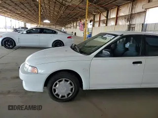 2001 Mitsubishi Mirage ES z VIN JA3AY26CX1U013535, wystawiony jako Copart lot #57664885 z przebiegiem 159 095 mil mil oraz Szkoda całkowita • Salvage title. Historia ofert i sprzedaży dostępna na DreamBid. Obrazek 13.