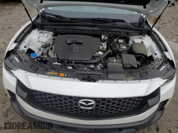 2025 Mazda CX-50 S Premium z VIN 7MMVABDM9SN331032, wystawiony jako Copart lot #60797015 z przebiegiem 9 572 mil mil oraz Nie do naprawy • Non repairable. Historia ofert i sprzedaży dostępna na DreamBid. Obrazek 12.