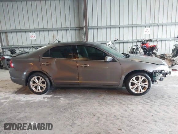 2012 Ford Fusion SE z VIN 3FAHP0HA9CR325249, wystawiony jako IAAI lot #41803339 z przebiegiem 203 650 mil mil oraz . Historia ofert i sprzedaży dostępna na DreamBid. Obrazek 13.