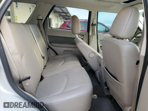 2009 Mercury Mariner Premier z VIN 4M2CU87739KJ21572, wystawiony jako Copart lot #83665504 z przebiegiem 181 858 mil mil oraz Szkoda całkowita • Salvage title. Historia ofert i sprzedaży dostępna na DreamBid. Obrazek 11.