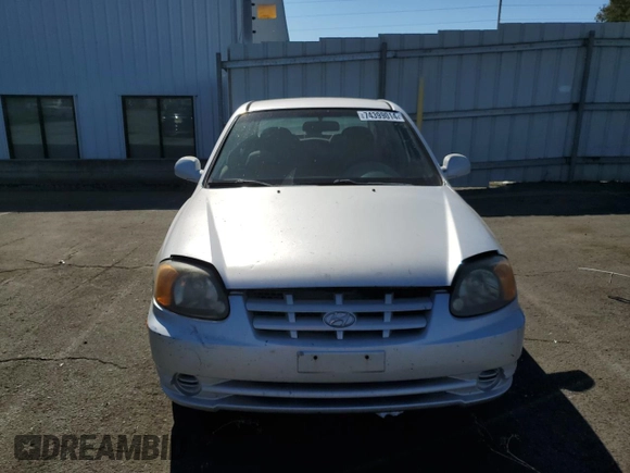 2003 Hyundai Accent GL with VIN KMHCG45CX3U488238, listed as a Copart auction lot 74399014 with 130,915 mi miles and Clean Title. Bid and sale history available at carsss.com. Image 5.