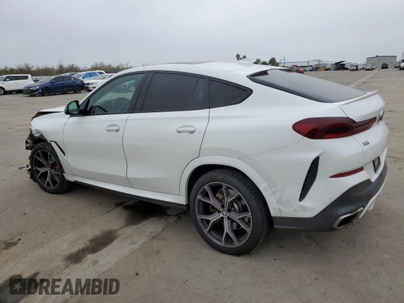 2021 BMW X6 M50i with VIN 5UXCY8C04M9D98395, listed as a Copart auction lot 85536134 with 57,891 mi miles and Salvage Title. Bid and sale history available at carsss.com. Image 2.