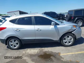 2013 Hyundai Tucson GLS with VIN KM8JU3AC3DU551018, listed as a IAAI auction lot 41988305 with 214,728 mi miles. Bid and sale history available at carsss.com. Image 13.