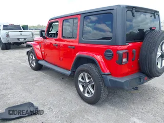 2019 Jeep Wrangler Unlimited Sahara with VIN 1C4HJXEG4KW573157, listed as a IAAI auction lot 42118373 with 105,890 mi miles and . Bid and sale history available at DreamBid. Image 3.