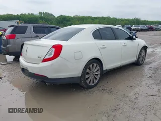 2013 Lincoln MKS EcoBoost with VIN 1LNHL9FT4DG604661, listed as a IAAI auction lot 42211781 with 134,902 mi miles and . Bid and sale history available at DreamBid. Image 4.