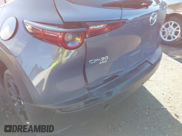 2023 Mazda CX-30 S Carbon Edition with VIN 3MVDMBCM3PM579345, listed as a IAAI auction lot 41689892 with 18,621 mi miles and . Bid and sale history available at DreamBid. Image 6.