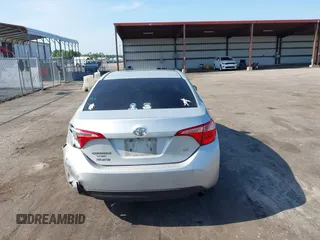 2018 Toyota Corolla L with VIN 5YFBURHEXJP810003, listed as a IAAI auction lot 42526648 with 84,546 mi miles and . Bid and sale history available at DreamBid. Image 17.