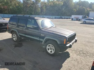 1998 Jeep Cherokee Sport with VIN 1J4FT68S5WL136989, listed as a Copart auction lot 81035084 with 140,848 mi miles and Salvage Title. Bid and sale history available at carsss.com. Image 4.