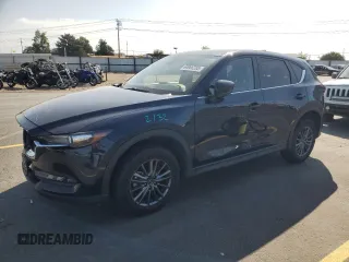 2020 Mazda CX-5 Touring z VIN JM3KFBCM5L0792465, wystawiony jako Copart lot #60906285 z przebiegiem 128 393 mil mil oraz Szkoda całkowita • Salvage title. Historia ofert i sprzedaży dostępna na DreamBid. Obrazek 1.