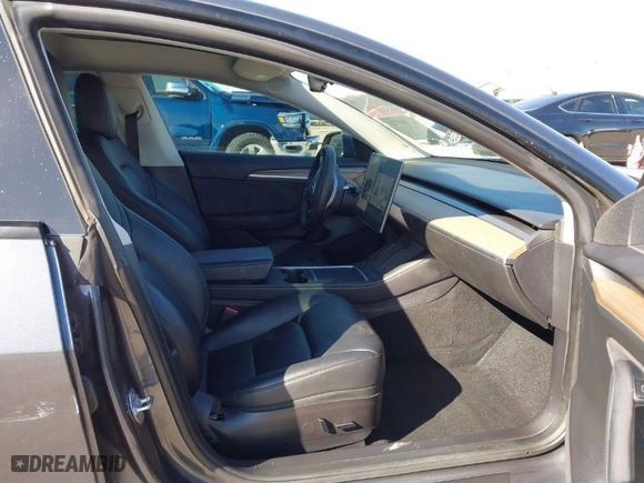2022 Tesla Model 3 Long Range with VIN 5YJ3E1EB9NF197127, listed as a IAAI auction lot 41366323 with 56,559 mi miles. Bid and sale history available at carsss.com. Image 5.