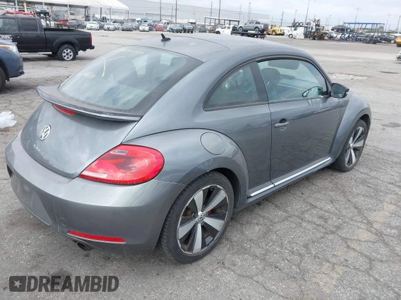 2012 Volkswagen Beetle 2.0T Turbo w/Sun/Snd/Nav PZEV with VIN 3VWVA7AT5CM653829, listed as a IAAI auction lot 42121383 with 114,474 mi miles. Bid and sale history available at carsss.com. Image 4.