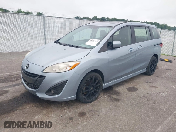 2012 Mazda 5 Touring with VIN JM1CW2CL7C0115096, listed as a IAAI auction lot 42524956 with 173,155 mi miles and . Bid and sale history available at DreamBid. Image 2.