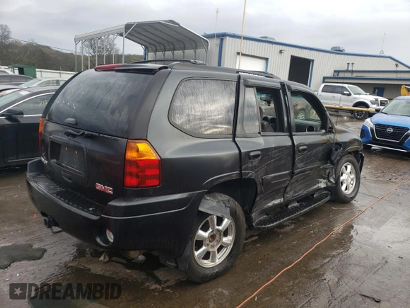 2004 GMC Envoy SLT with VIN 1GKDT13S042310076, listed as a Copart auction lot 79965854 with 220,506 mi miles and Salvage Title. Bid and sale history available at carsss.com. Image 3.