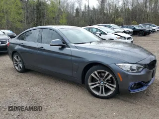 2015 BMW 4 Series 428i xDrive with VIN WBA4A7C5XFD413329, listed as a Copart auction lot 56034905 with 167,816 mi miles and Clean title. Bid and sale history available at DreamBid. Image 4.