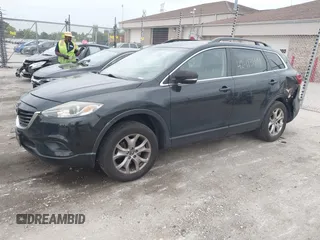 2014 Mazda CX-9 Sport with VIN JM3TB3BV8E0437180, listed as a IAAI auction lot 42413844 with 177,393 mi miles and . Bid and sale history available at DreamBid. Image 2.