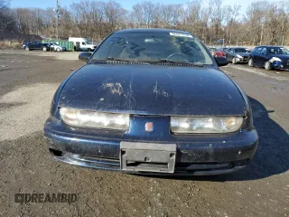 1999 Saturn SL with VIN 1G8ZK5270XZ184042, listed as a Copart auction lot 86827254 with Not Provided miles and Salvage Title. Bid and sale history available at carsss.com. Image 5.