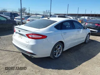 2016 Ford Fusion SE Hybrid with VIN 3FA6P0LU1GR127280, listed as a IAAI auction lot 41754682 with 194,357 mi miles. Bid and sale history available at carsss.com. Image 4.