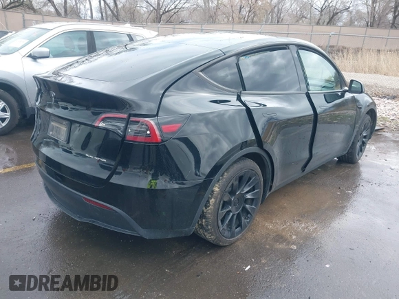 2023 Tesla Model Y Long Range with VIN 7SAYGDEE5PF766685, listed as a IAAI auction lot 41933729 with 25,959 mi miles and . Bid and sale history available at DreamBid. Image 4.