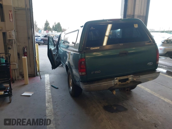 1997 Ford F-150 XL with VIN 1FTEX18L1VKB44867, listed as a IAAI auction lot 41266572 with 105,061 mi miles. Bid and sale history available at carsss.com. Image 3.