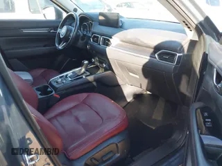 2021 Mazda CX-5 Touring with VIN JM3KFBCM9M0434433, listed as a IAAI auction lot 41425112 with 57,527 mi miles. Bid and sale history available at carsss.com. Image 5.