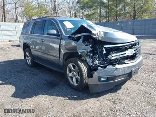 2019 Chevrolet Tahoe LT with VIN 1GNSKBKC0KR121493, listed as a IAAI auction lot 41656734 with 163,994 mi miles. Bid and sale history available at carsss.com. Image 1.