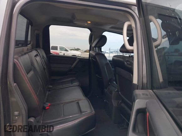 2010 Nissan Titan Pro-4X with VIN 1N6BA0EC9AN323943, listed as a IAAI auction lot 42795482 with 200,453 mi miles and . Bid and sale history available at DreamBid. Image 8.